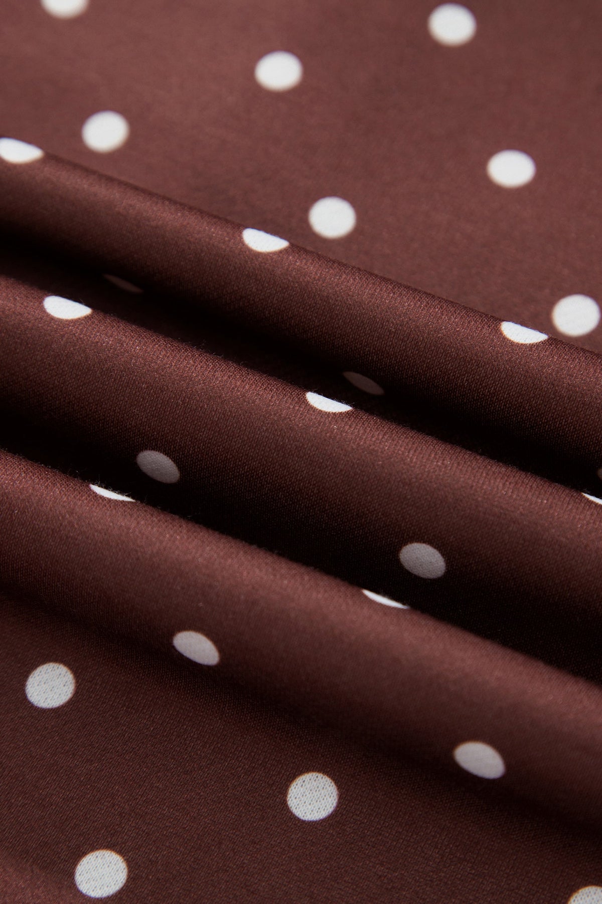 Polka dot pullover sweatshirt with metal-button collar