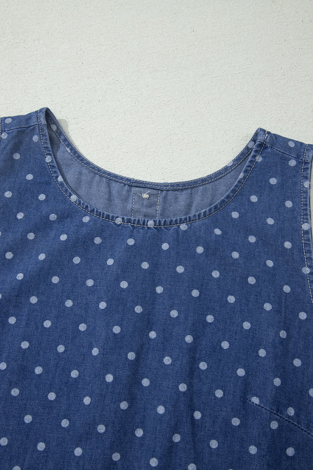 Polka dot sleeveless shift dress with ruffle hem