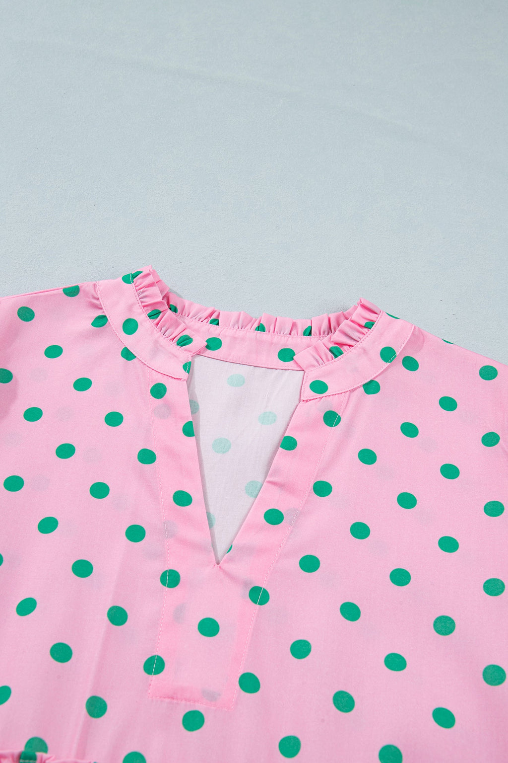 Polka dot V-neck tiered mini dress with puff sleeves