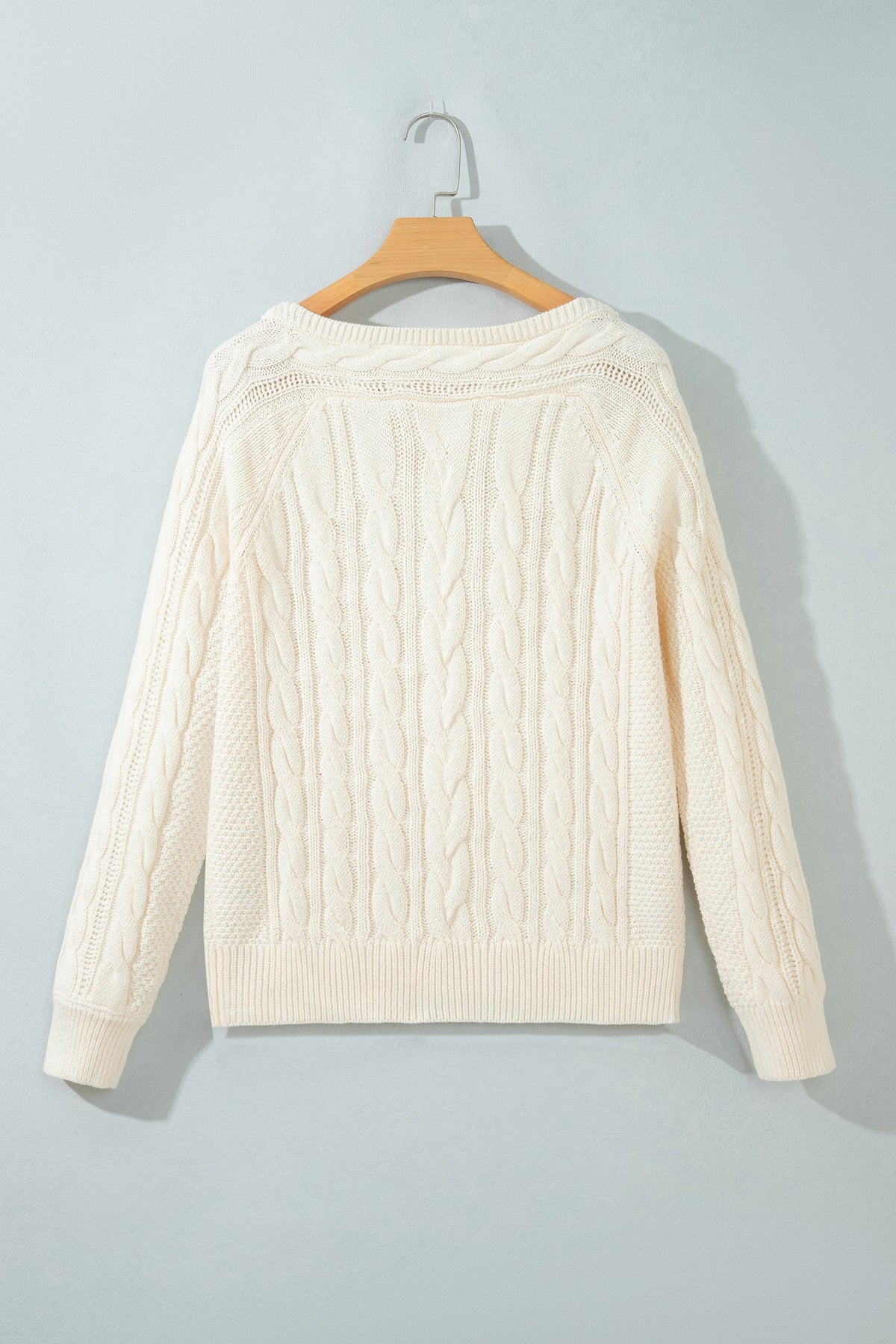 Boutique-style cable knit sweater with relaxed drop shoulders