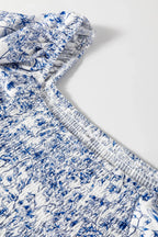 Floral smocked babydoll blouse with square neckline