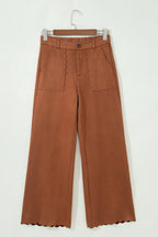 High-waist trousers with scalloped edges and zip pockets