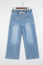 Wide-leg blue jeans with elastic drawstring waist and patch pockets