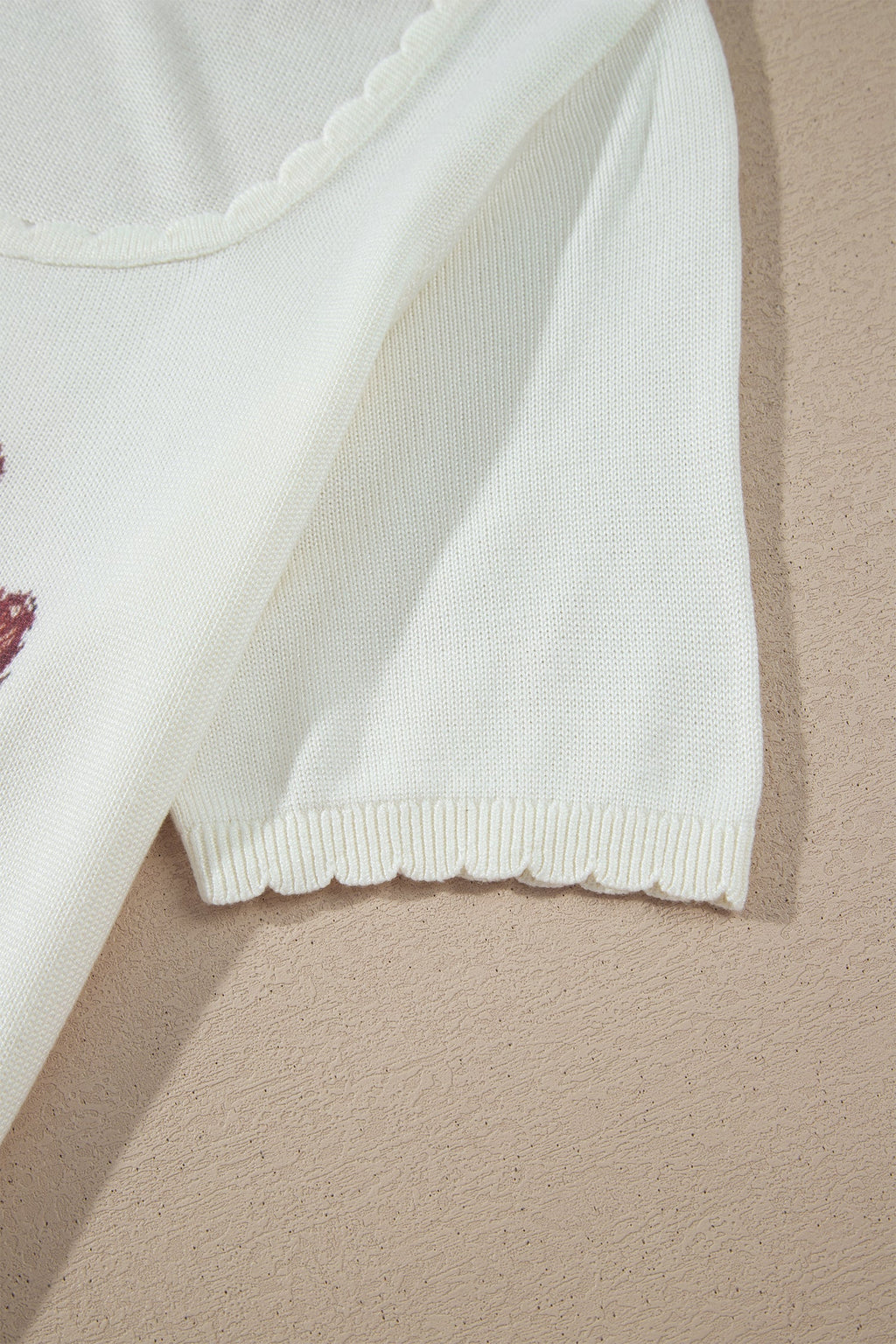 Western floral knit top with scalloped neckline