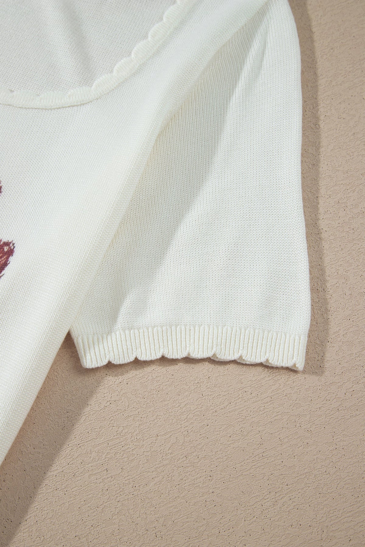 Western floral knit top with scalloped neckline
