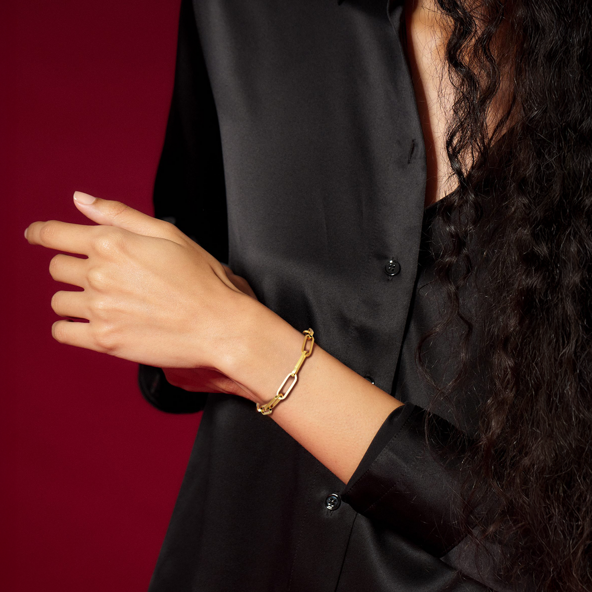 Model wearing the Jemma gold paperclip link bracelet