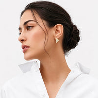 Geometric gold Supera earrings with pavé accents