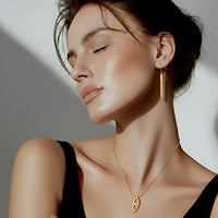 Gold dangling bar earrings with pavé stones