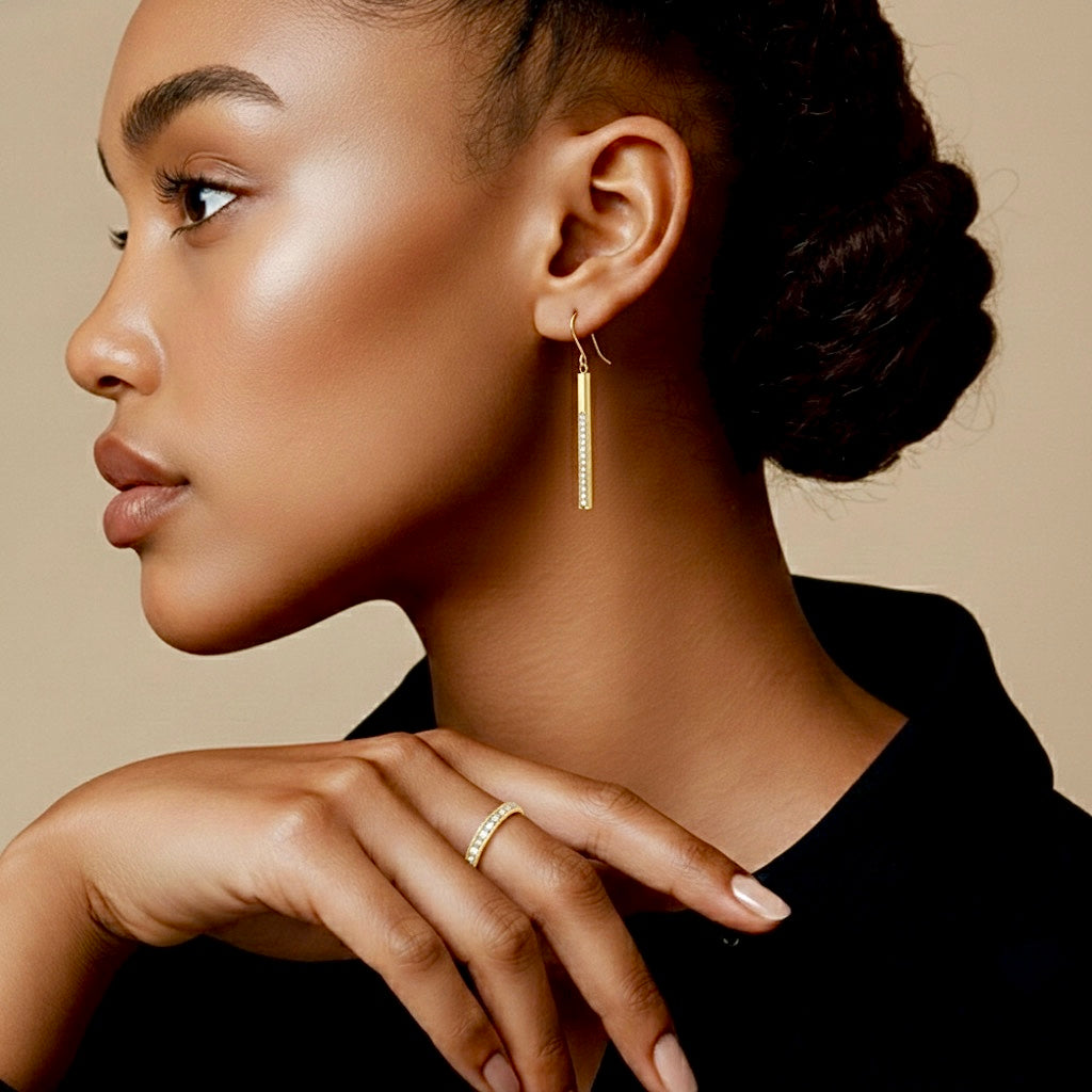 Gold dangling bar earrings with pavé stones