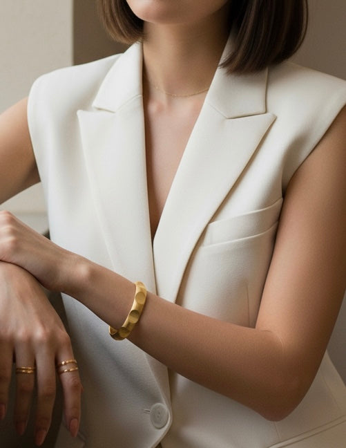 Gold adjustable bangle cuff with circular indent design
