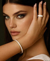 Gold-plated wide-band ring with white enamel