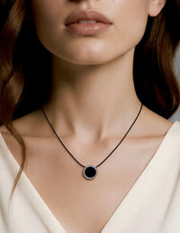 Halo black enamel pendant with pavé stones