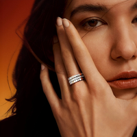 Silver Mon Rêve hexagonal stackable ring trio worn on hand