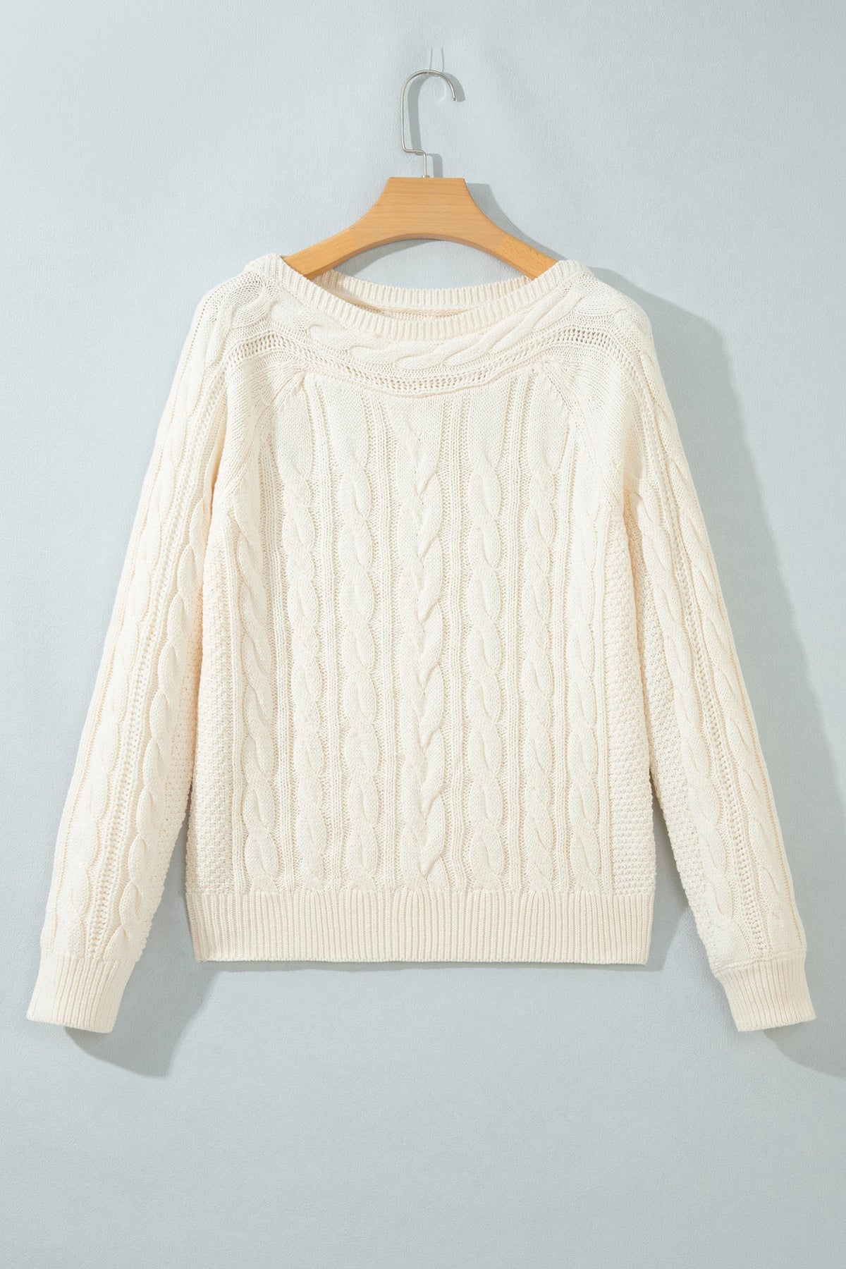 Boutique-style cable knit sweater with relaxed drop shoulders