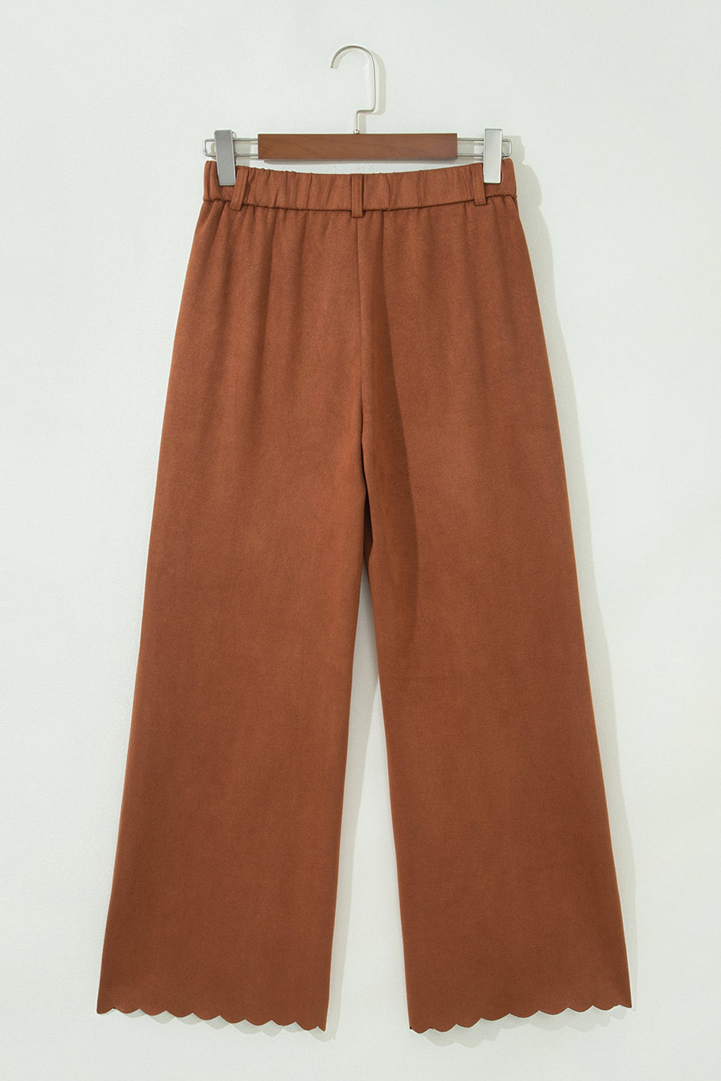 High-waist trousers with scalloped edges and zip pockets