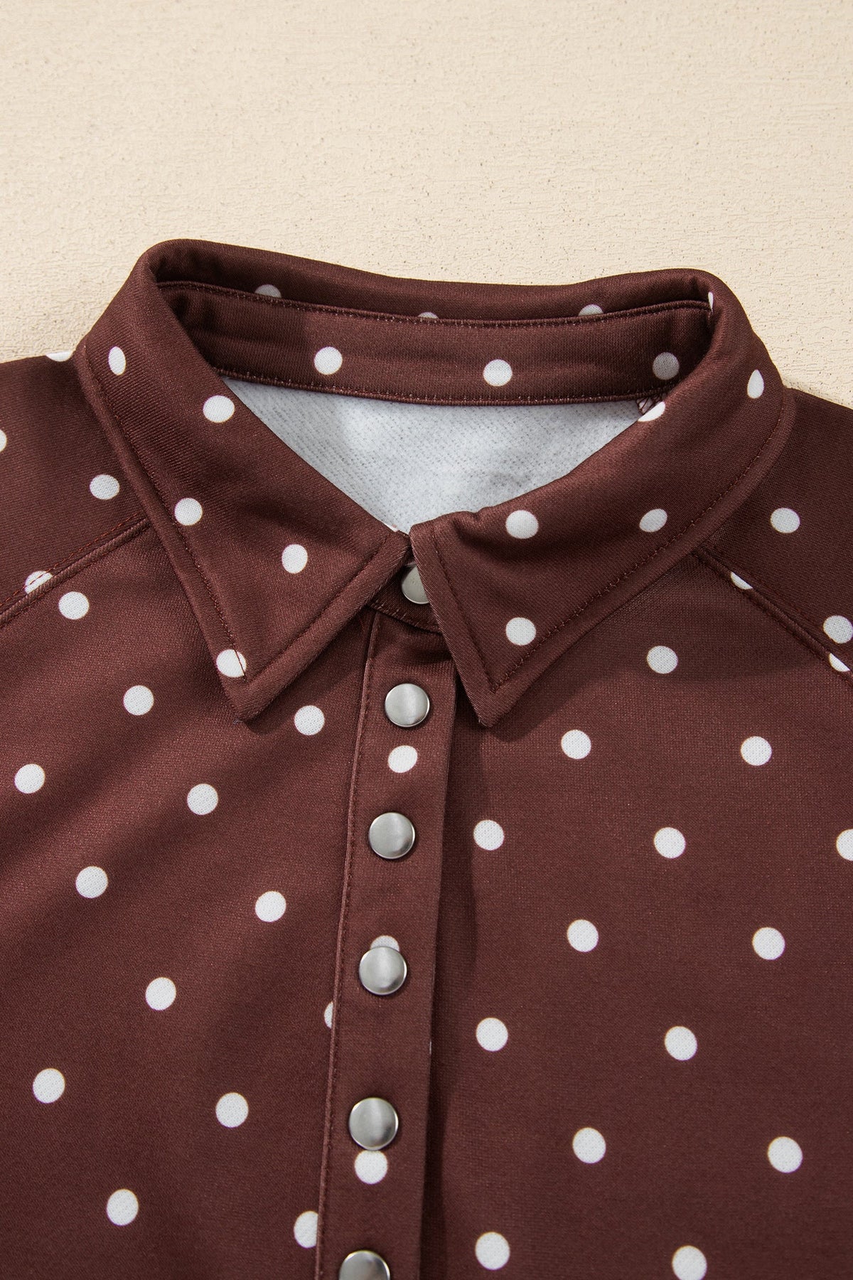 Polka dot pullover sweatshirt with metal-button collar
