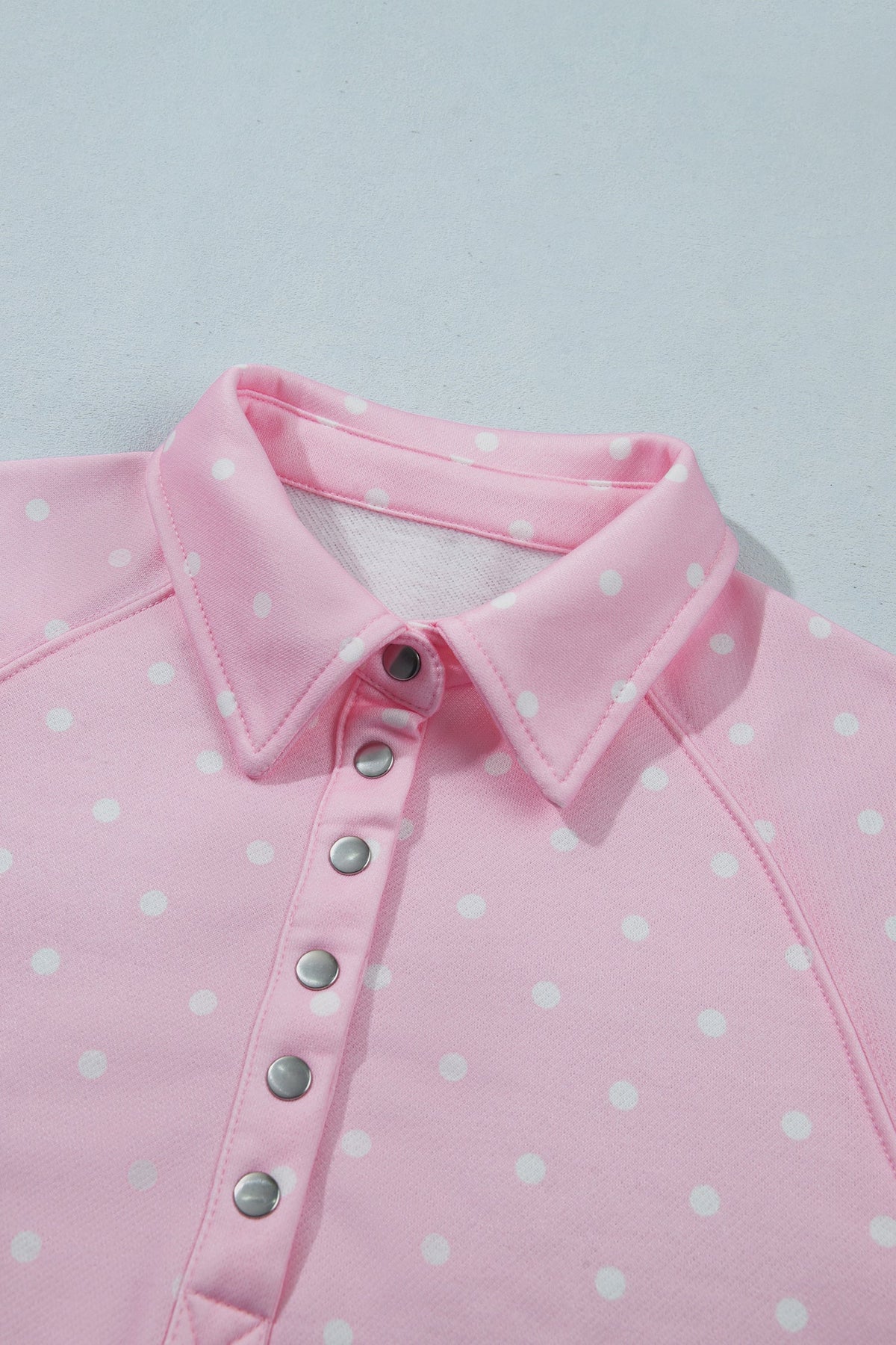 Polka dot pullover sweatshirt with metal-button collar