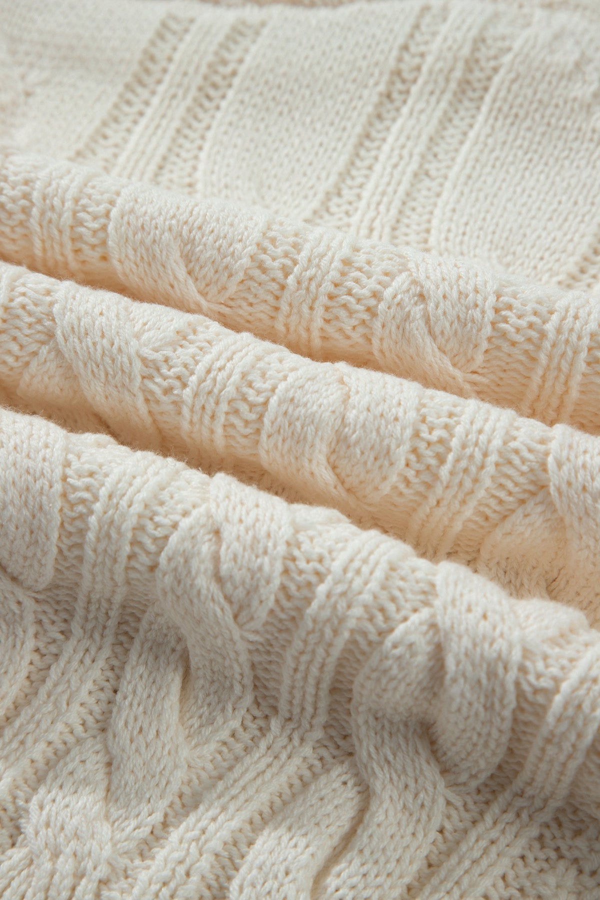 Boutique-style cable knit sweater with relaxed drop shoulders